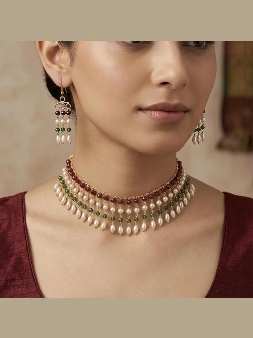 Elegant-gold-choker-featuring-sparkling-red-and-green-crystal-accents