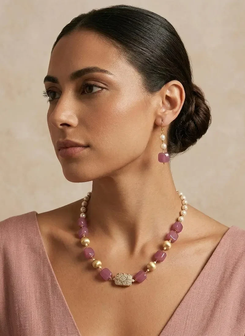 Square pink agate stones with shell pearls and golden balls, finished with a spinel pendant.