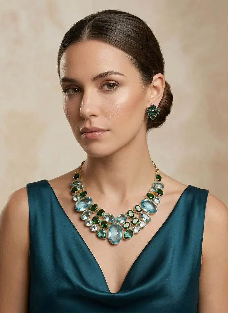 Aqua marine and green agate statement necklace set in a gold base, paired with matching stud earrings.