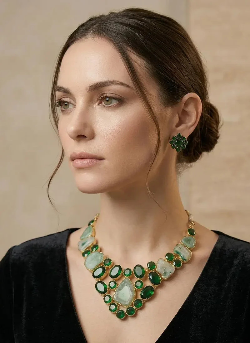 Raw green agate statement necklace set in a gold base, paired with matching stud earrings.