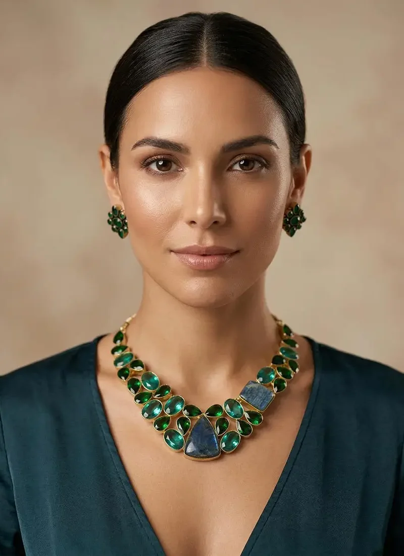 Green agate statement necklace with blue lapis lazuli centerpiece set in a gold base, paired with matching stud earrings.