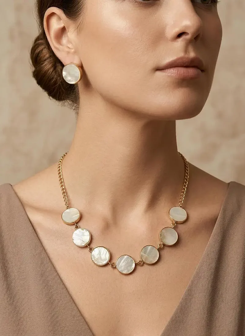 Mother of Pearl neckpiece set with matching earrings.