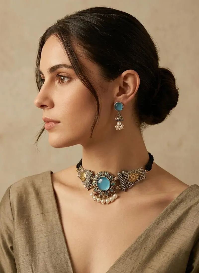 Antique silver earrings with blue agate stone and pearl danglings, paired with matching earrings.