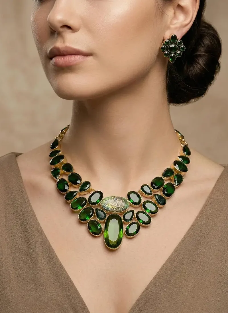 Green agate statement necklace with opal centerpiece set in a gold base, paired with matching stud earrings.