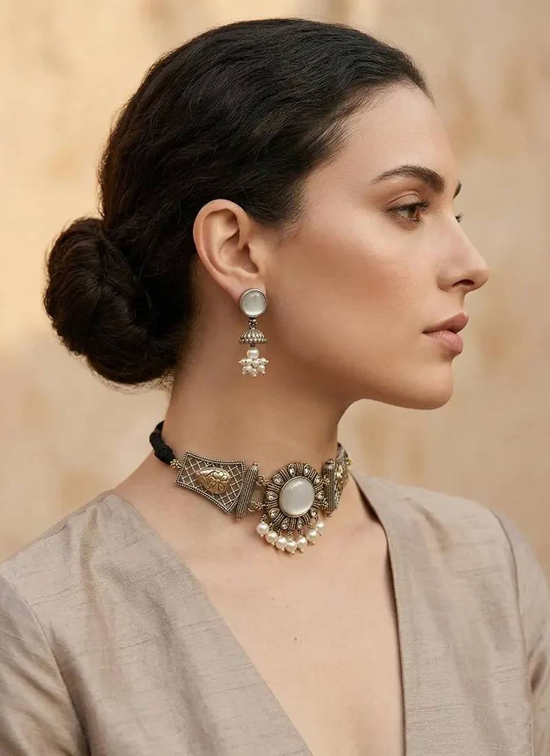 Antique silver earrings with white agate stone and pearl danglings, paired with matching earrings.