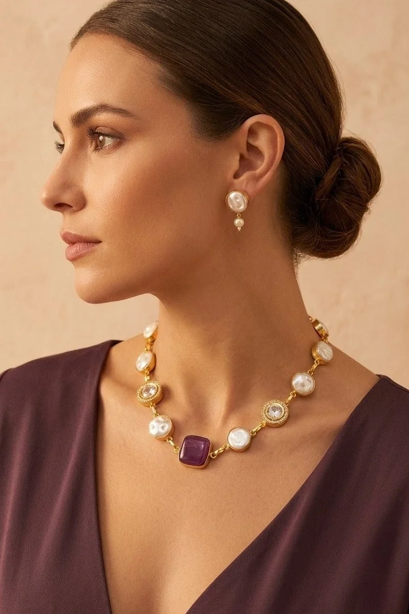 A striking blend of semi-precious red stone, mother of pearl, and shimmering zircon accents, paired with matching earrings.