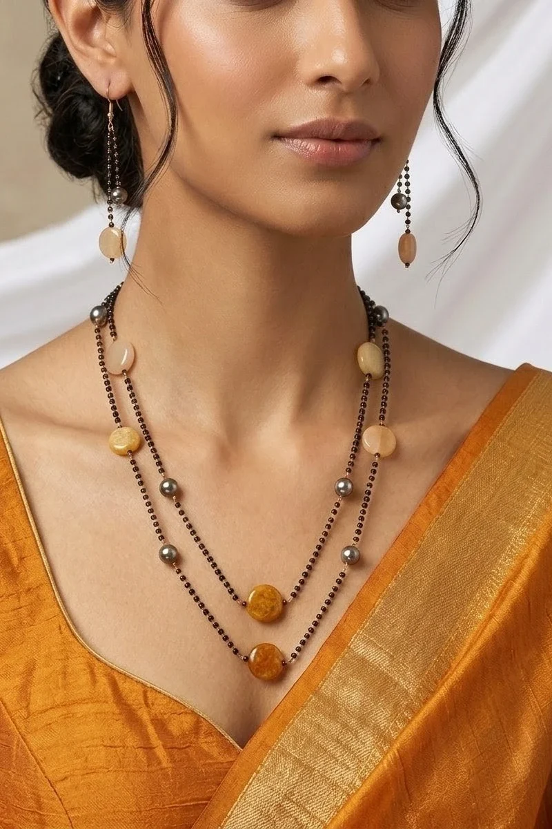 Two-layer karimani necklace accented with multi-color semi-precious stones, paired with matching earrings.