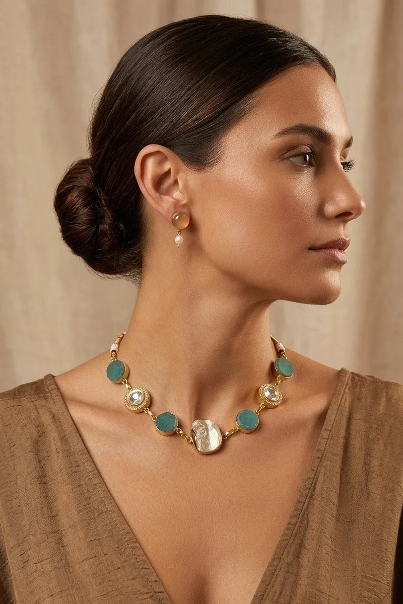 A striking blend of Mother of pearl ,  green druzy, and shimmering zircon accents, paired with matching earrings.