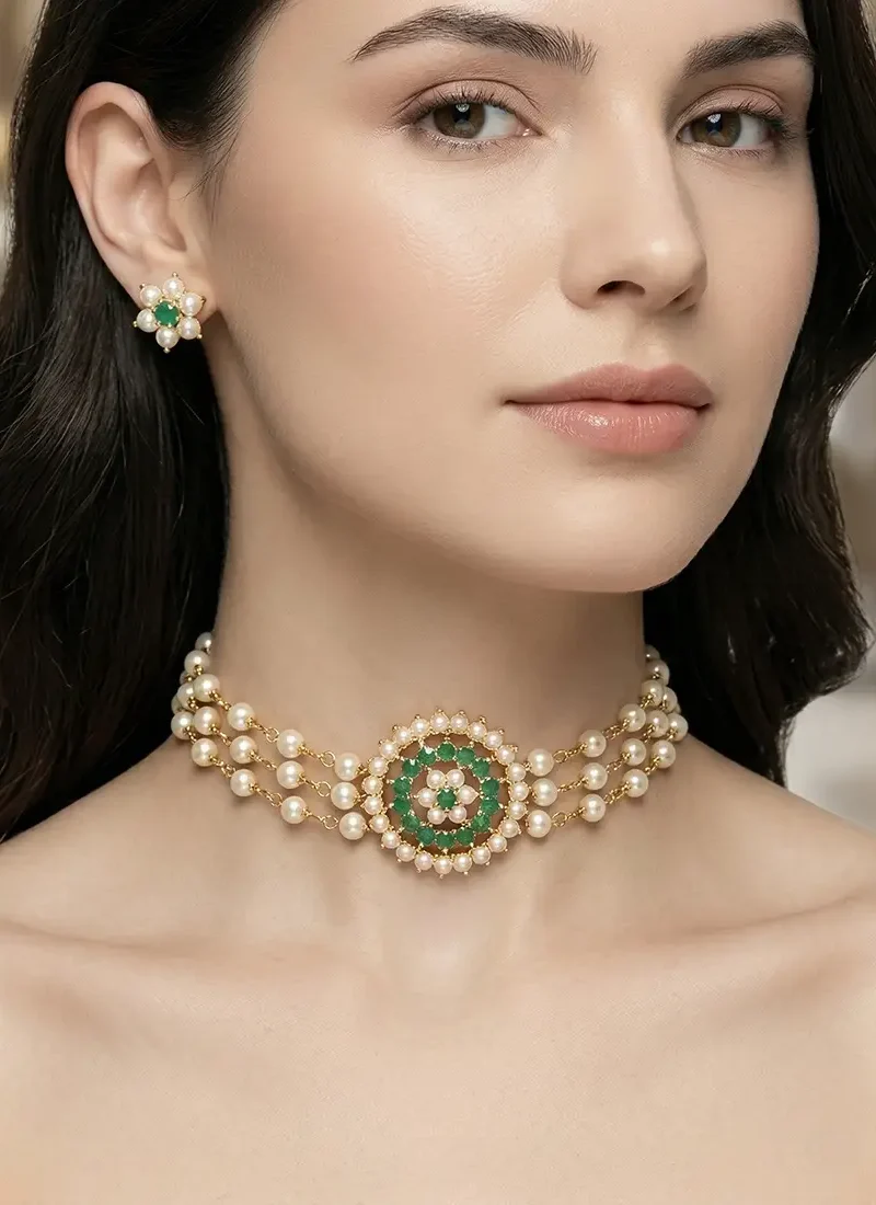 Multi-layer shell pearl choker featuring a green zircon stone pendant with matching earrings.