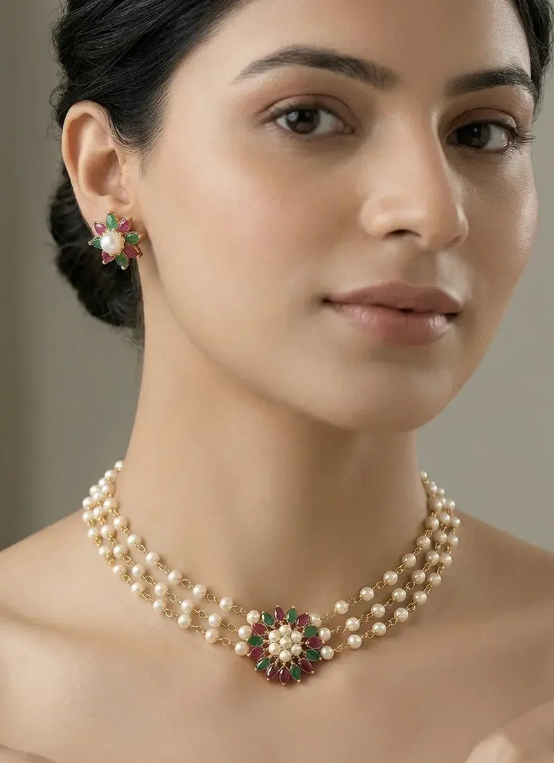 Multi-layer shell pearl choker featuring a multi color zircon stone pendant with matching earrings.
